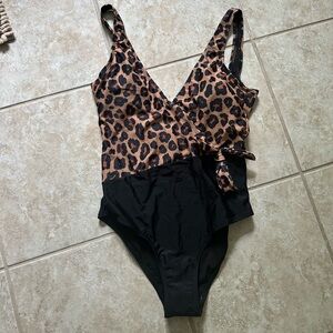 Pink lily leopard one piece. NWOT size large